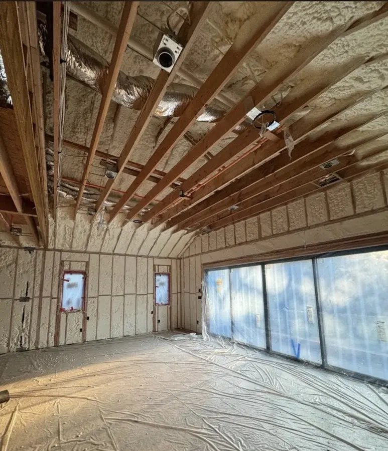 Interior walls and ceiling insulated with spray foam during new construction in Franklin Farm
